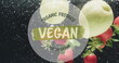 Image of vegan food text over fruit falling in water background