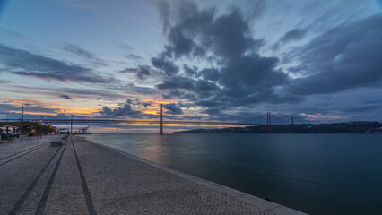 Wall Mural - Lisbon city sunrise with April 25 bridge timelapse