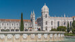 Jeronimos monastery and fountain seen from the Imperio garden timelapse in Lisbon, Portugal.