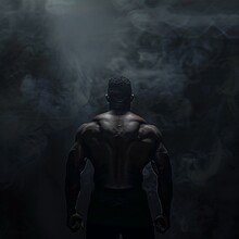 A Man Stands Shirtless In A Dark Room, Surrounded By Smoke And Mist