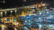 © neiezhmakov - Seaport and loading docks at the port with cranes and multi-colored cargo containers night timelapse