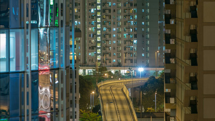 Wall Mural - Top view of busy traffic night in finance urban timelapse, Hong Kong city