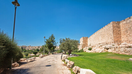 Wall Mural - Defensive wall of the ancient holy Jerusalem timelapse hyperlapse, lit by the bright sun.