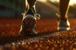 Close-up of a runner's feet on a starting block, ready to sprint, focusing on the tension and anticipation 