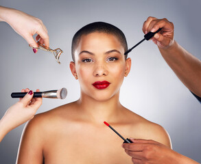 Hands, brushes and portrait of woman with red lips in studio for lipstick and mascara routine. Cosmetics, beauty and face of female person with facial cosmetology treatment by gray background.