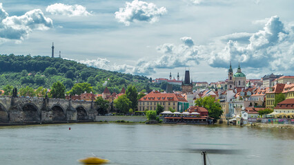 Wall Mural - Vltava river embankment timelapse in a sunny summer day. Prague, Czech Republic.