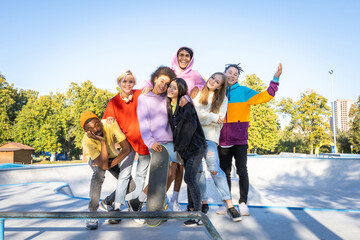 multiracial group of young friends bonding outdoors