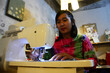 Traveler thai women people study learning art handicraft class use sewing machine sewing fabric shoulder small bag in handmade studio workshop of hotel hostel at Chiangrai city in Chiang Rai, Thailand