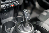 Fototapeta Paryż - Close up of Modern car automatic gearbox and control buttons..