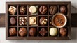 Chocolate candy box / Assortment of fine chocolates in white, dark, and milk chocolate and a bowl of melted chocolate