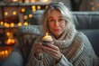 © Pinklife - A serene woman enjoys a birthday celebration with a cupcake and lit candle, set against a warm backdrop of bokeh lights