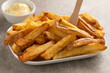  Fresh baked French peel potato fries and mayonnaise
close up