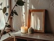 Serene corner with candle and frame.