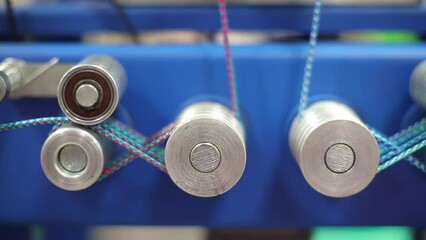 Leinwandbilder - Working Industrial machine for weaving multi-colored textile ropes and cords close-up, industrial concept background