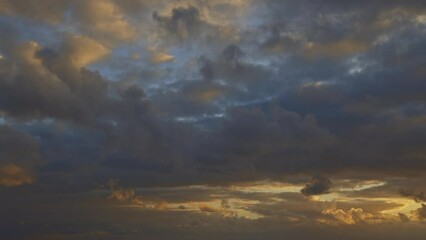 Wall Mural - The sky is cloudy and the sun is setting - timelapse