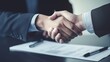 Business negotiation meeting involves handshake and contract signing, sealing agreements and formalizing terms between parties for mutual understanding and commitment.
