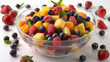 Mixed fruit salad in the bowl on white background. 