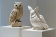 Recycled plastic sculptures of an owl and a rabbit displayed on museum plinths.

