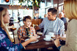 © Davor - Family enjoying time together at a cafe