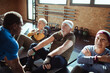 © Davor - Senior adults participating in a fitness class at the gym