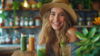 Beautiful happy woman sitting with drinks and healthy green food at home. Vegan meal and detox concept.