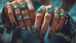 Close up of woman's hands with lots of rings and painted nails. Beautiful hands female wearing rings in each finger