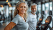 © aekkorn - senior woman man exercise gym fitness couple sport healthy elderly health training active happy portrait old fit mature female adult workout body vitality.