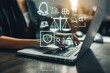 © Studium L&M - Modern legal tech and cybersecurity: Woman uses laptop with virtual justice icons.
