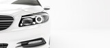Fototapeta  - Front view of a modern hybrid car close up on a white background