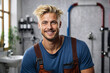 The plumber is a man.Smiling. Portrait. Against the background of the toilet and pipes.Bright, light background.