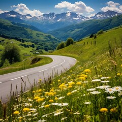 Canvas Print - b'Scenic view of a winding road through a valley with snow capped mountains in the distance'