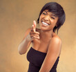 You, pointing or portrait of black woman with hair care for keratin growth, healthy shine or wellness. Laughing, studio or face of happy girl with natural texture, joke or glow on brown background