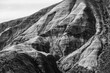 Stunning black and white photograph capturing the intricate, textured layers of a mountain landscape, showcasing natural beauty and geological formations.