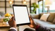 © Eggy - Tablet held by Man in a Living Room - Mockup for Application or Web Design - Template for Presentation of Graphic Design - Corporate Representation at Consumers
