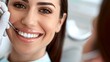 © Irina Ukrainets - Close-up of a smiling woman receiving dental treatment. Conceptual image for oral health care, dental hygiene, and happy patient experience. Professional dentistry work in progress. AI