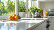 © DigitaArt.Creative - The overall ambiance is bright and airy, thanks to the abundant natural light flooding the space. White countertops take center stage, adorned with fresh oranges and various kitchen utensils