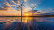 Solar panels and wind turbines at dawn