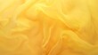 Texture of yellow satin fabric as background, closeup of photo