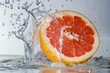 grapefruit splashing into clear water with dramatic ripples and droplets