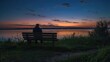 Lonely person sitting on a wooden bench alone at dusk looking at the sunset