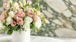 An elegant floral composition featuring a delicate blend of pink white and green blooms such as roses spray roses and lush greenery set against a backdrop of marble in soft pink and white h
