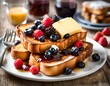 french toast with berries, syrup, and butter