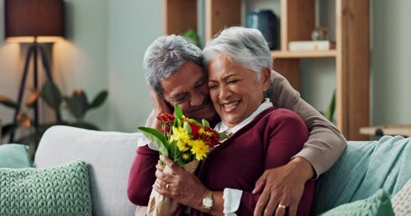 Sticker - Couple, woman and old man with gift of flowers on sofa or couch, happy and living room of house. Senior, male person and partner with surprise for love, smile and happiness in home and retirement