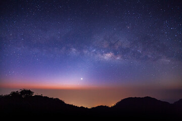 Wall Mural - landscape silhouette tree on high moutain before sunrise with milky way galaxy