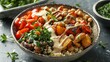 A high-angle view of a simple grain bowl with quinoa, roasted vegetables, and tahini dressing.