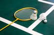 Competitive sports idea with badminton rackets and shuttlecock