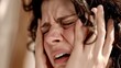 Dynamic mental health close up Mature woman touching her head with her hands while having a headache pain and feeling unwell