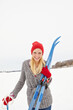 Woman, ski and snow with portrait on holiday for fitness, adventure and outdoor in mountains with smile. Person, happy and equipment for winter sports in nature for vacation getaway in Switzerland