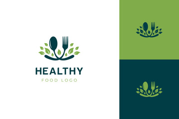 healthy food logo icon design with a fork spoon and leaf graphic shape for branding organic food bus