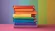 © nialyz - Stack of Rainbow-Colored Books on Pink Surface